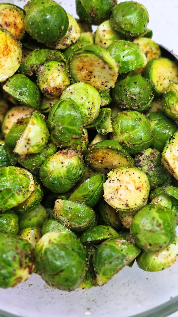 Mix brussels sprouts with spices 