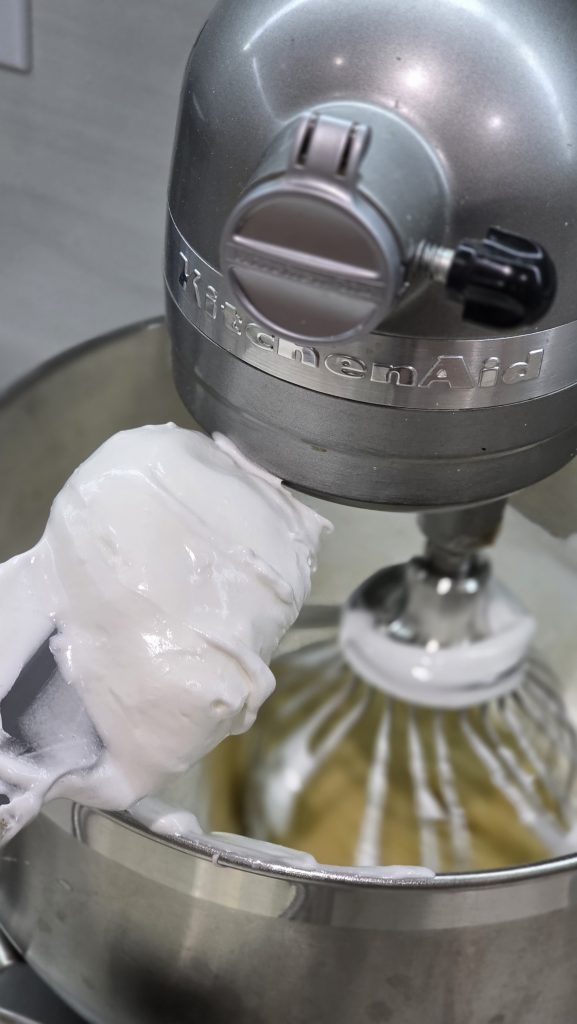 combine the whipped egg whites with the yolk batter