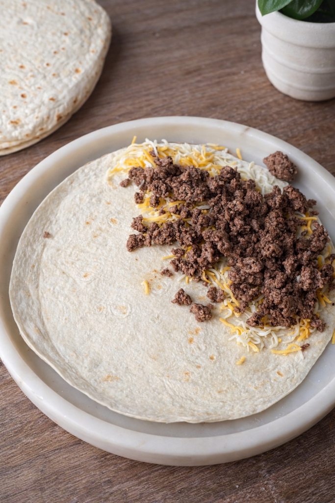 Quick and easy ground beef quesadillas made with simple ingredients in one skillet. Crispy, cheesy, kid-friendly 15-minute lunch or dinner idea.