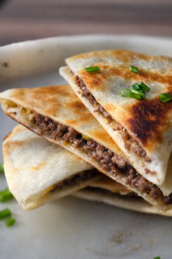 Quick and easy ground beef quesadillas made with simple ingredients in one skillet.
