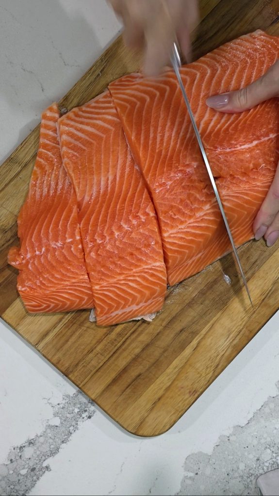 Cut the salmon into even portions.