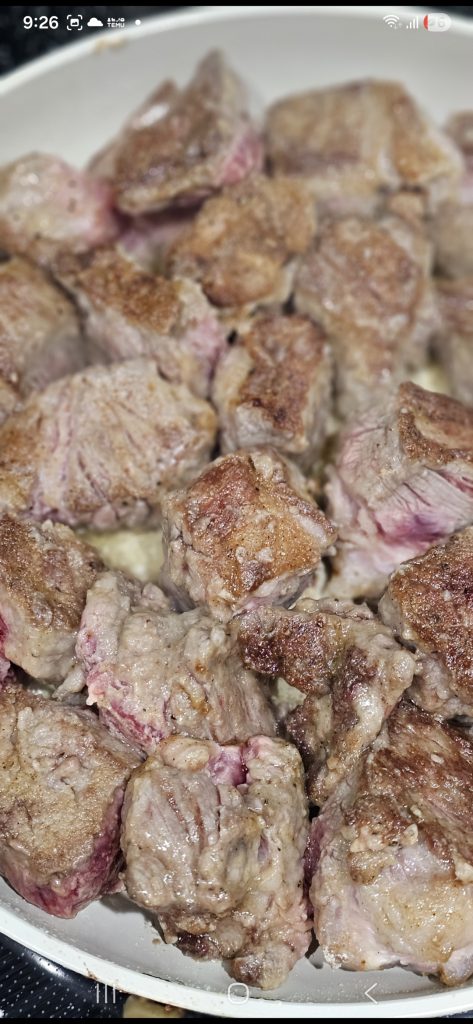 Heat oil in a large skillet over medium-high heat. Sear beef in batches until deeply browned on all sides.