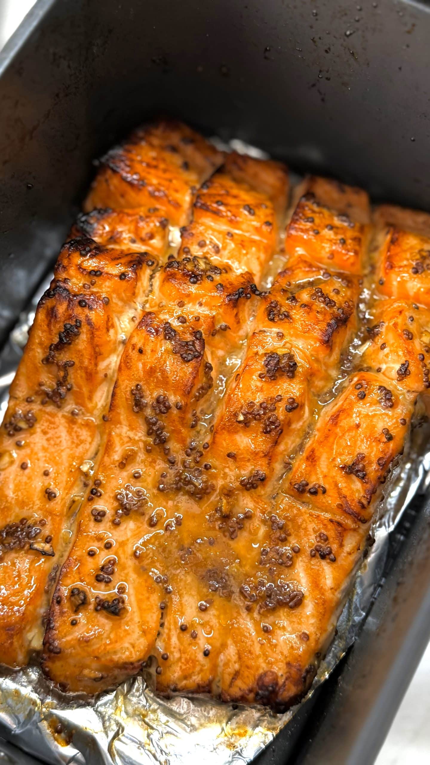 What is the best temperature for air fryer salmon?
380°F gives the best balance of caramelization and moisture.
